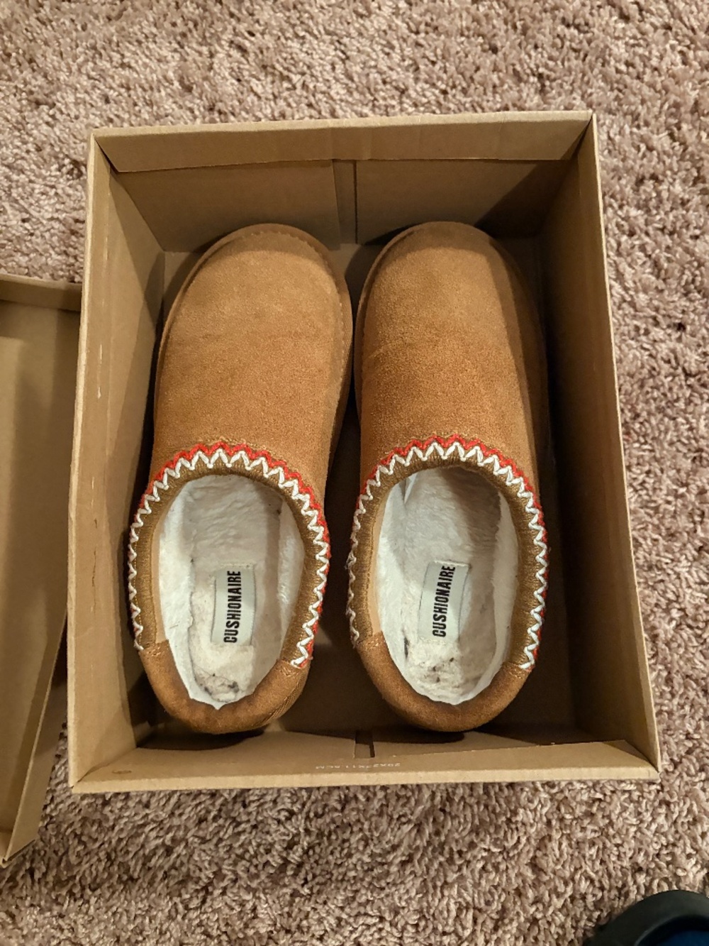 Comfortable CUSHIONAIRE slippers.